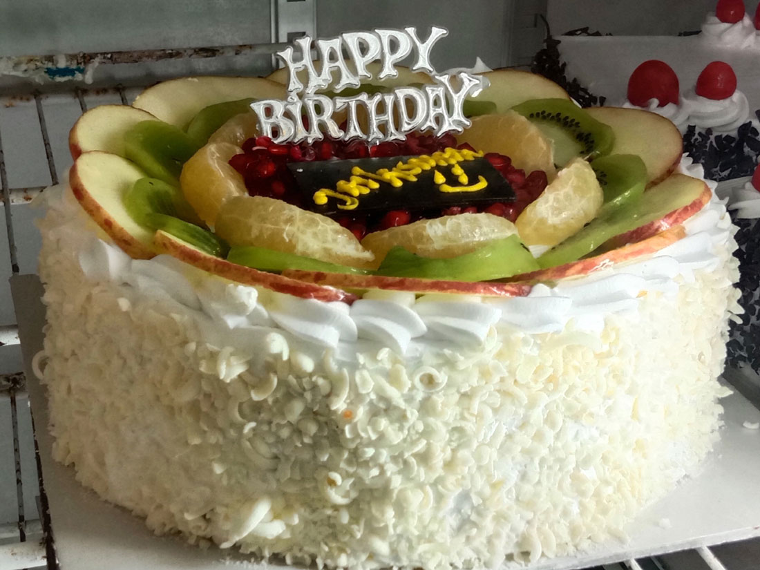 White Forest Birthday Cake with Fresh Apple, Kiwi &amp; Pomegranate Topping