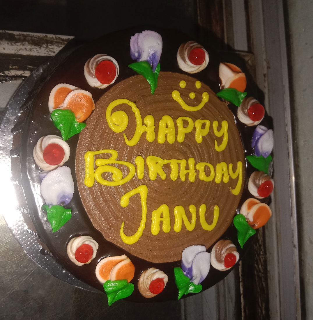 Delicious Chocolate Birthday Cake with Cream Decorations